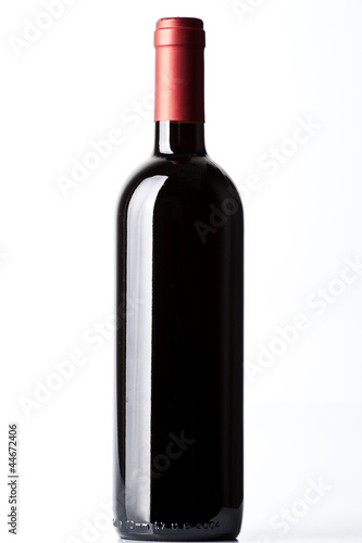A red wine bottle on the white background