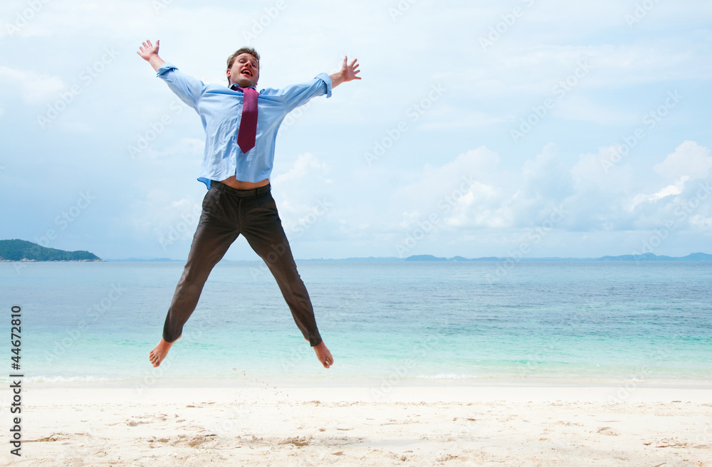 Funny business man jumping on the beach Funny business man jumping on the beach