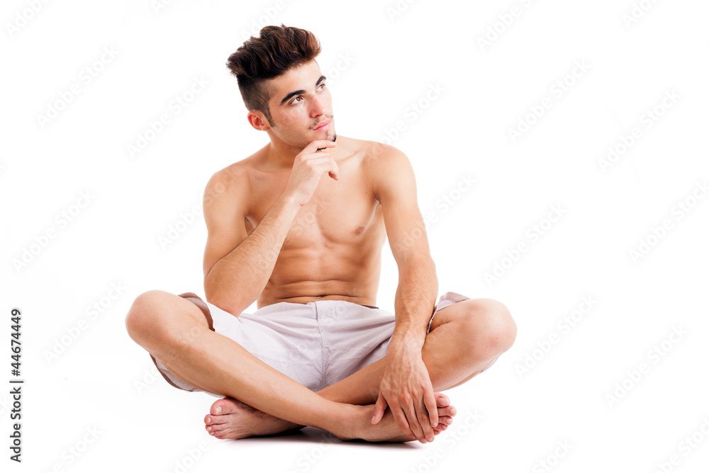 Portrait of shirtless muscular man thinking and looking up, isol Portrait of shirtless muscular man thinking and looking up, isol