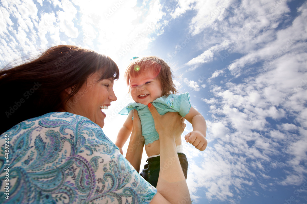 Mother Holding Daughter in Air Mother Holding Daughter in Air