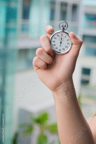 Hand Holding A Stopwatch  photo