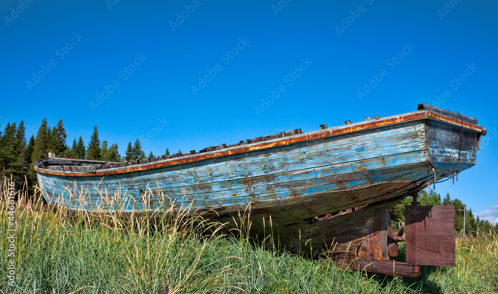 beached fishing trawler to give a well worn vintage look