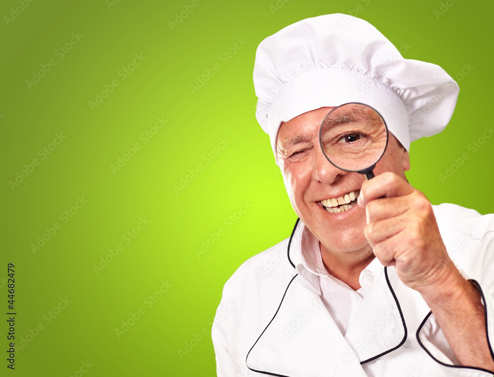 Portrait Of A Chef Holding Magnifying Glass Portrait Of A Chef Holding Magnifying Glass