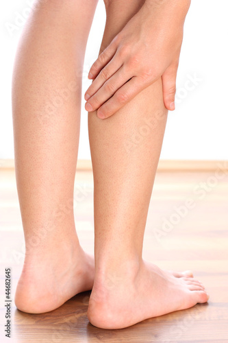 Woman holding leg