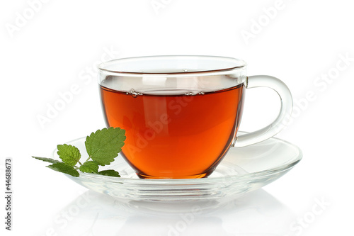 Tea cup with melissa leaves on a white background