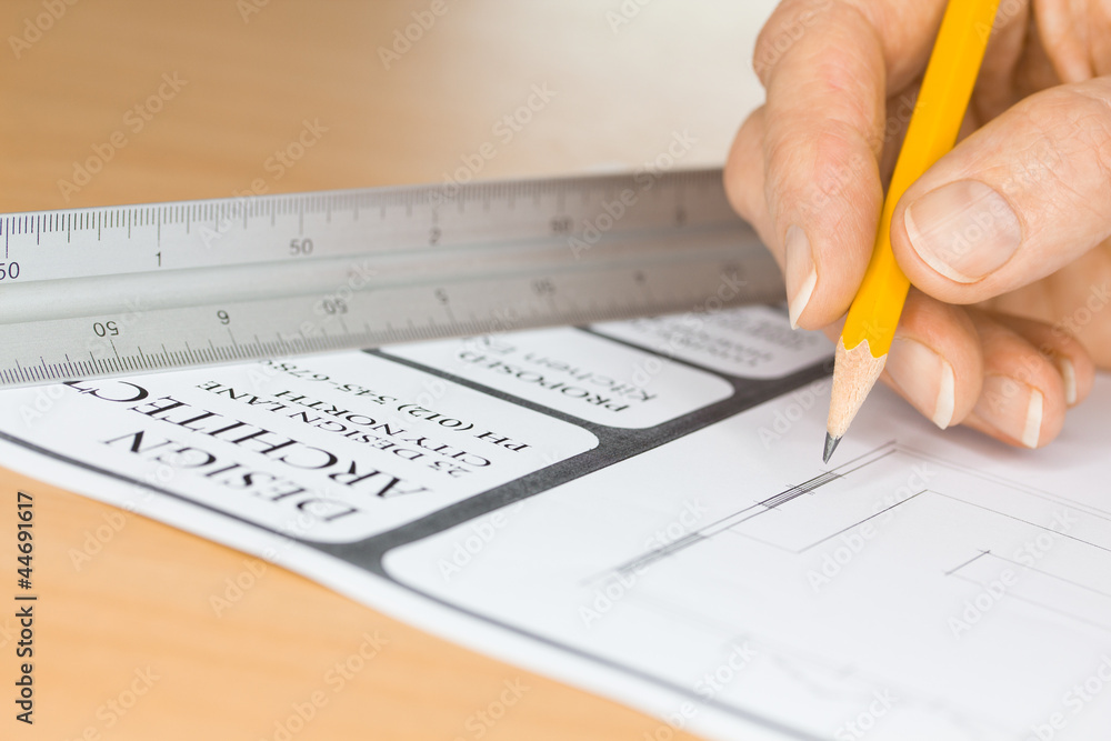 Architect Drawing Plans by Ruler Architect Drawing Plans by Ruler