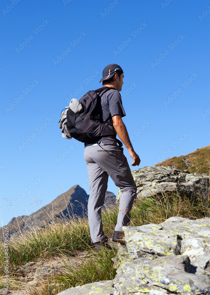 Man hiking, on mountain trail