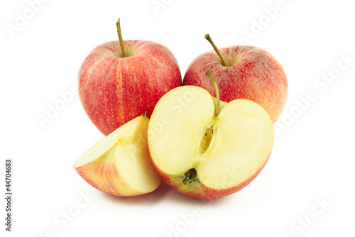 Two red apples, half and a slice