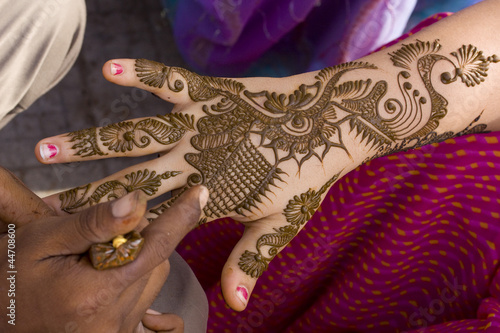 applying fresh henna on hand, wedding ,Rajasthan, India