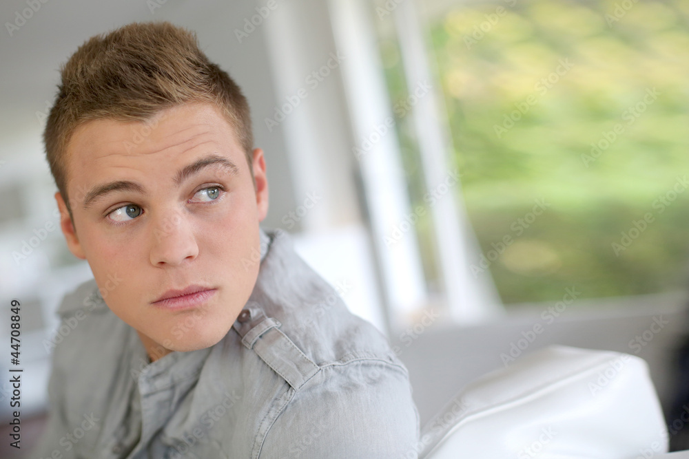 Portrait of handsome guy sitting in sofa Portrait of handsome guy sitting in sofa