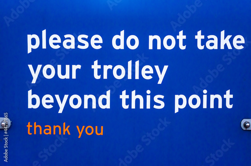 Supermaket sign for customers please do not take trolley beyond