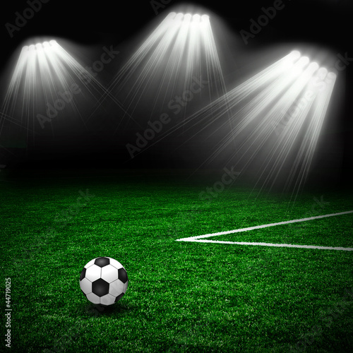 Soccer ball on the green field and lightning © Aleksandr Salenko