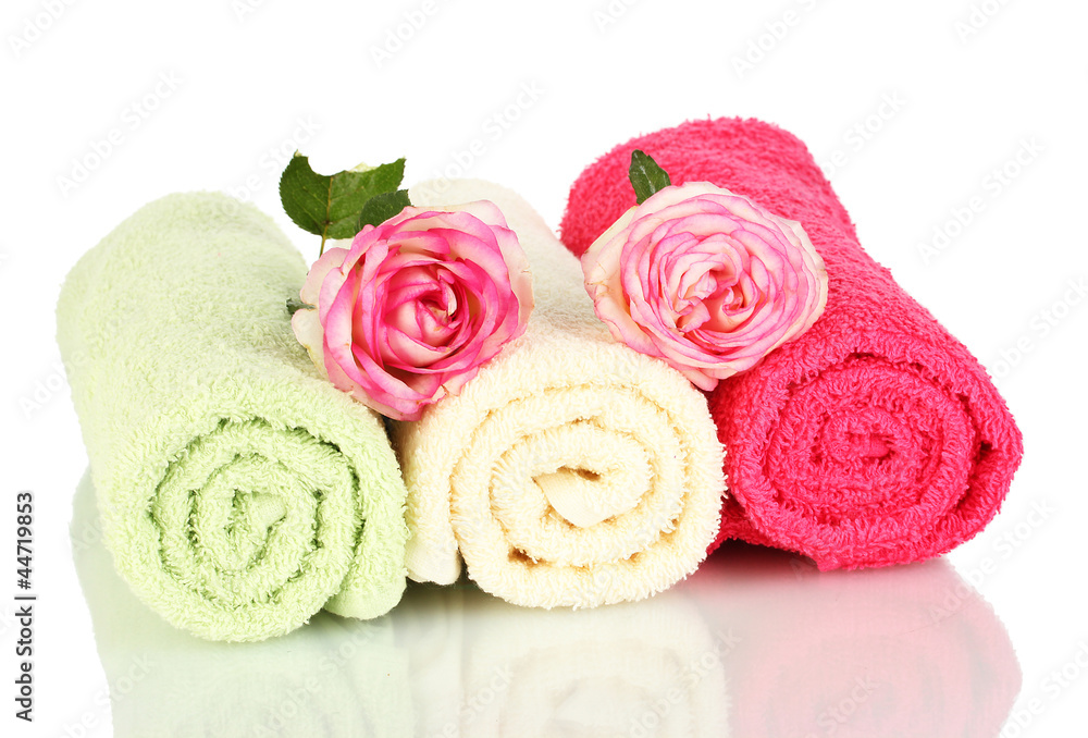 bright towels and roses isolated on white bright towels and roses isolated on white