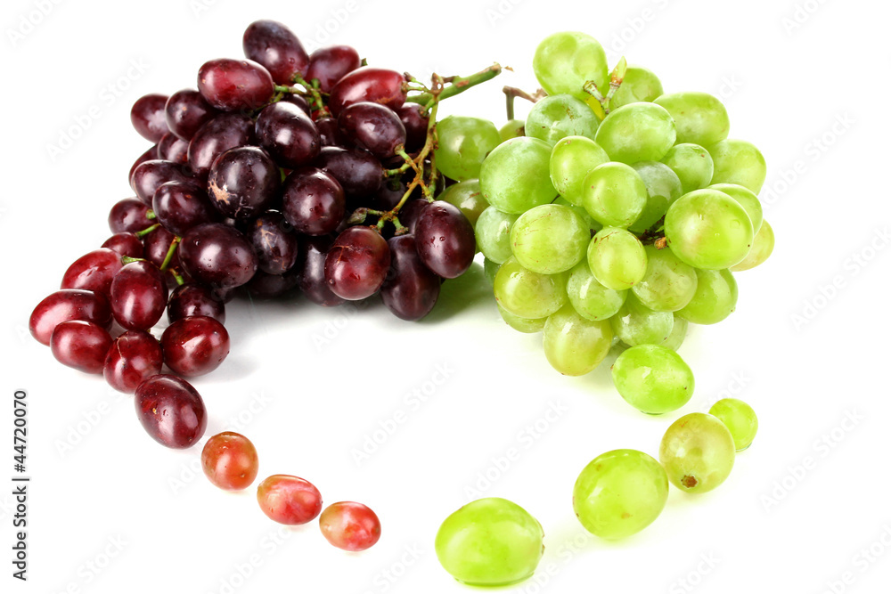 Delicious ripe pink and green grapes isolated on white