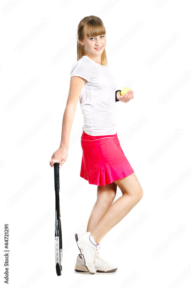 sporty teenage  girl standing with tennis racket and ball isolat