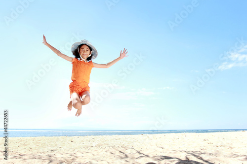 jumping girl in the beach