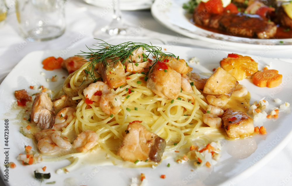 Spaghetti with Scampi and Salmon in Garlic sauce Spaghetti with Scampi and Salmon in Garlic sauce