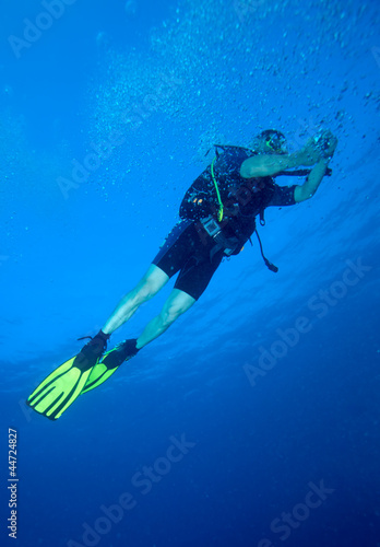 Diver with bright yellow fins