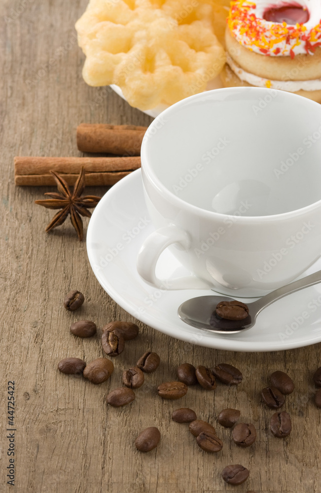 cup of coffee with beans and cakes on wood cup of coffee with beans and cakes on wood