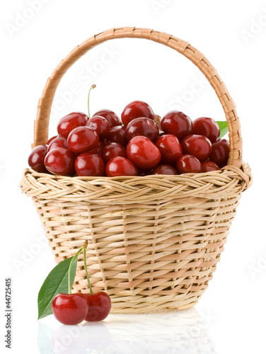sweet cherry in basket isolated on white