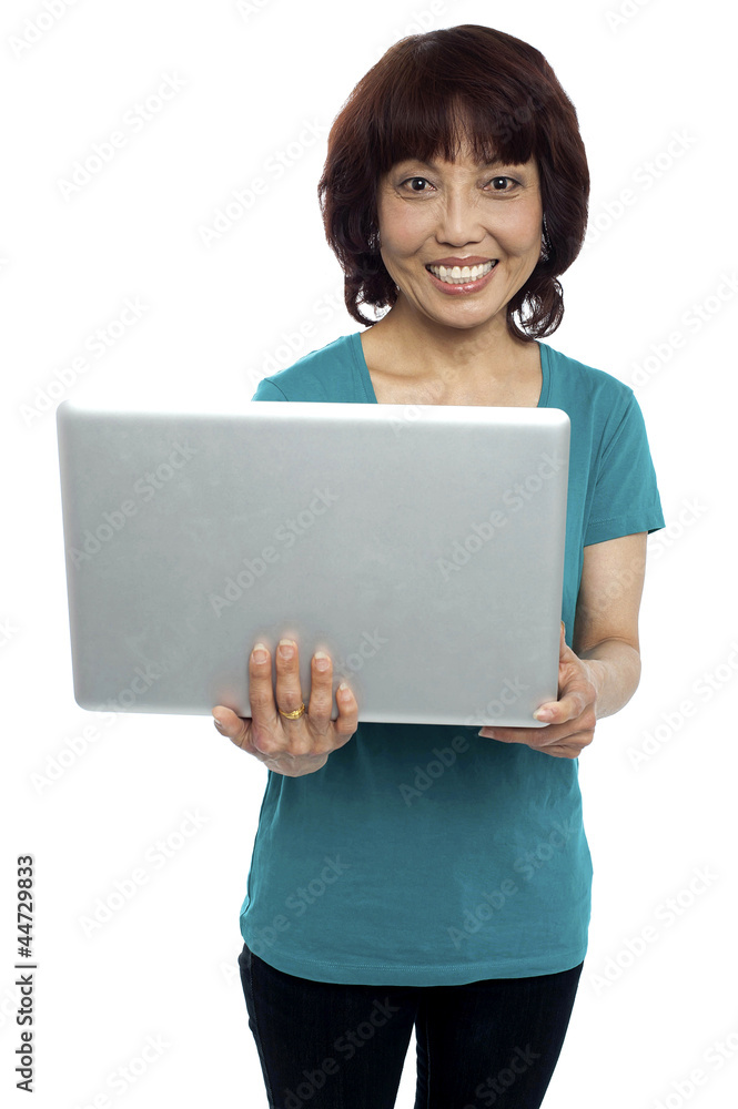 Casual asian girl holding laptop Casual asian girl holding laptop