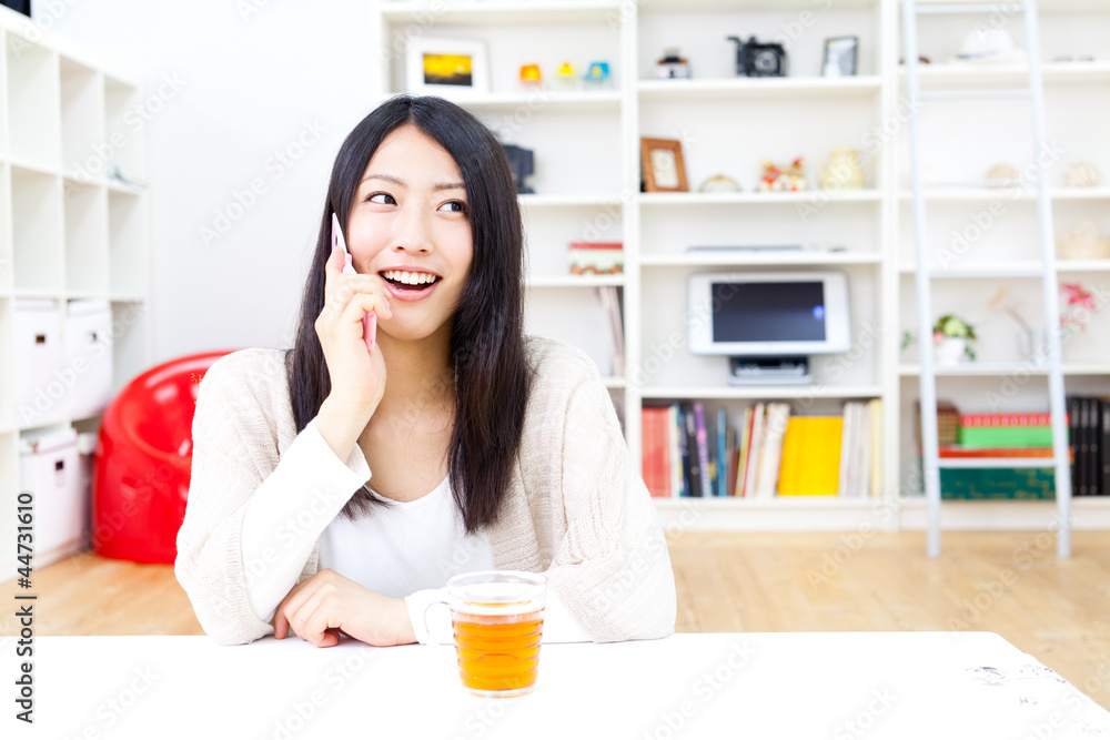 a young asian woman relaxing in the room a young asian woman relaxing in the room
