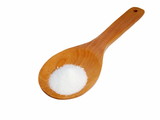 white salt in wooden spoon isolated on white background