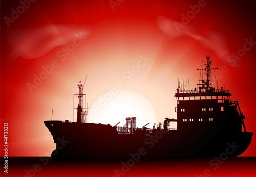 Vector silhouette of the tanker ship on sunset
