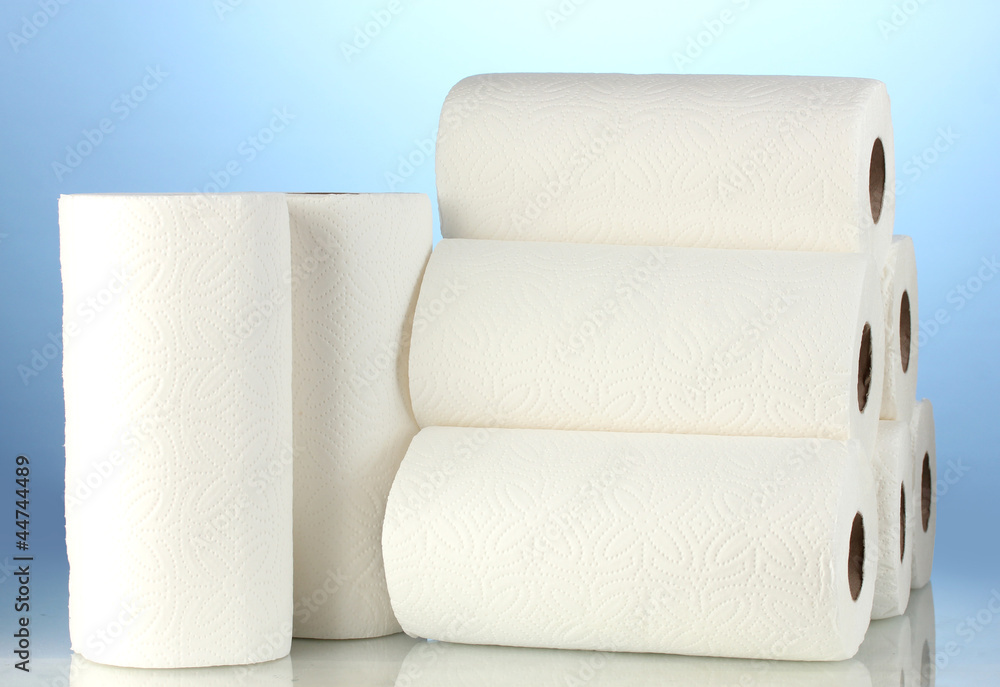 Obraz premium rolls of toilet paper on blue background