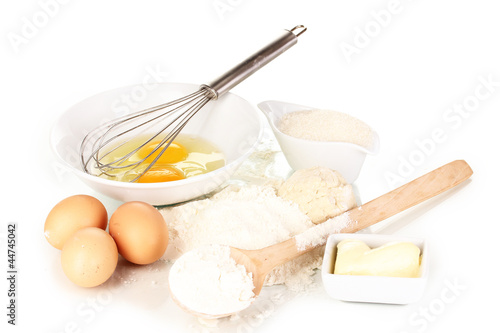 Eggs, flour and butter isolated on white