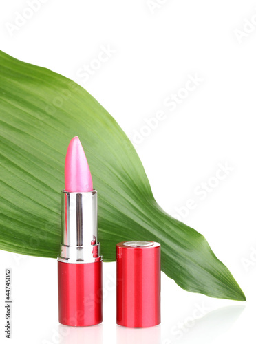 lipstick on green leaf isolated on white