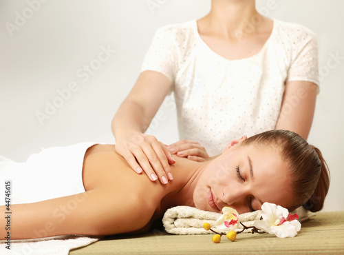 Closeup of an attractive young woman receiving massage