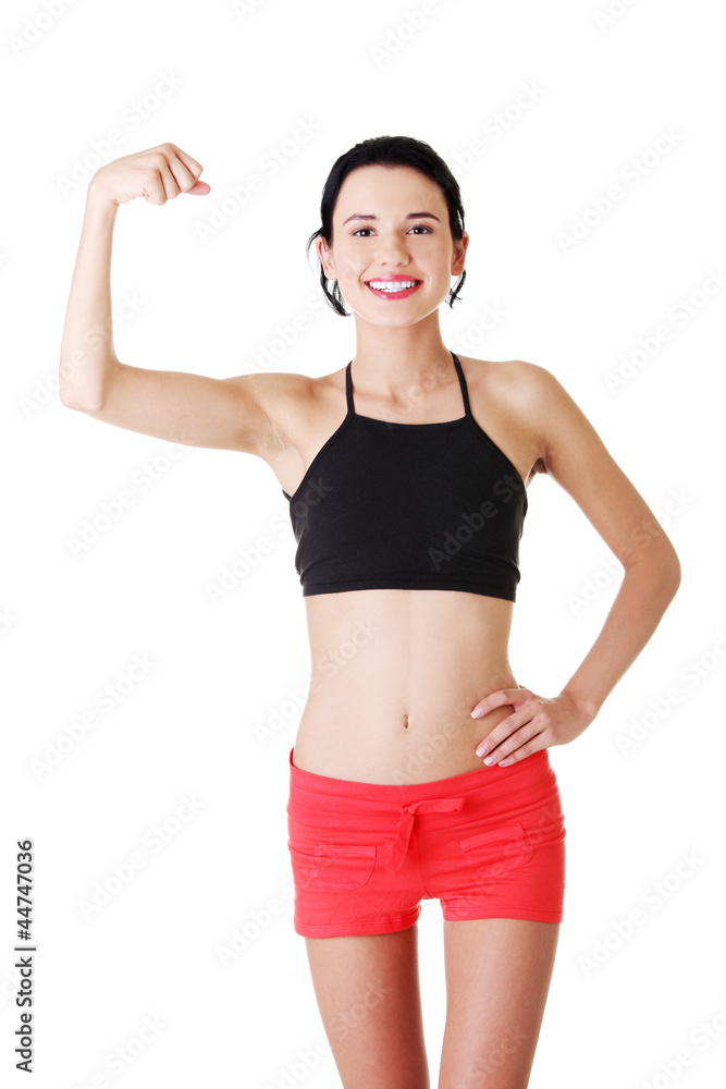 Portrait of beautiful young lady flexing her biceps on Portrait of beautiful young lady flexing her biceps on