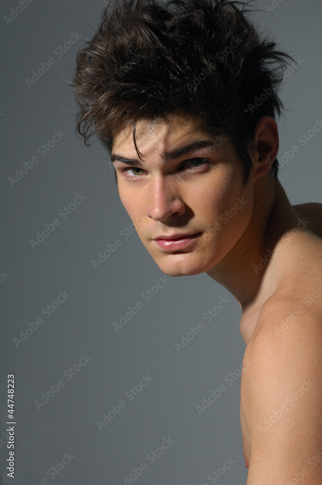 Handsome young man on gray Handsome young man on gray