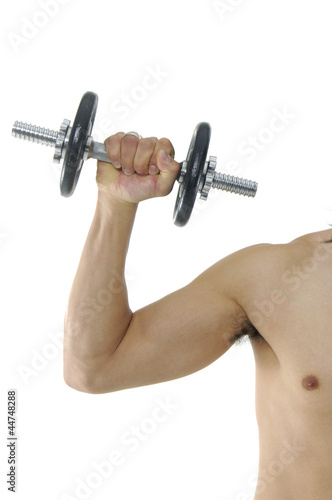 Healthy man hard workout of biceps in gym