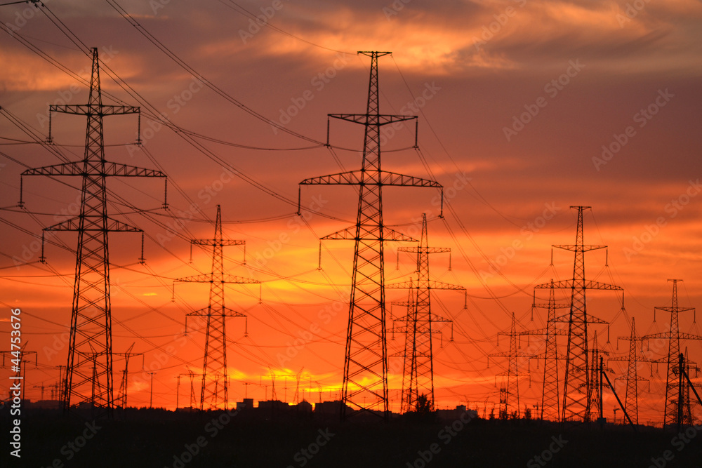 Electric power transmission lines at sunset