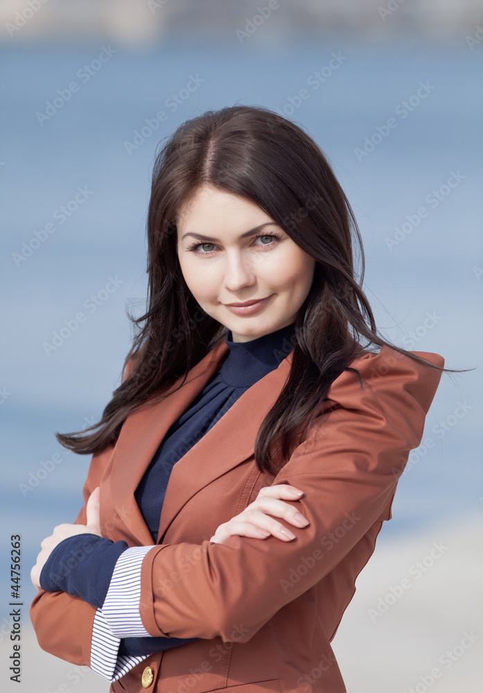 Portrait of attractive brunette in brown suit Portrait of attractive brunette in brown suit