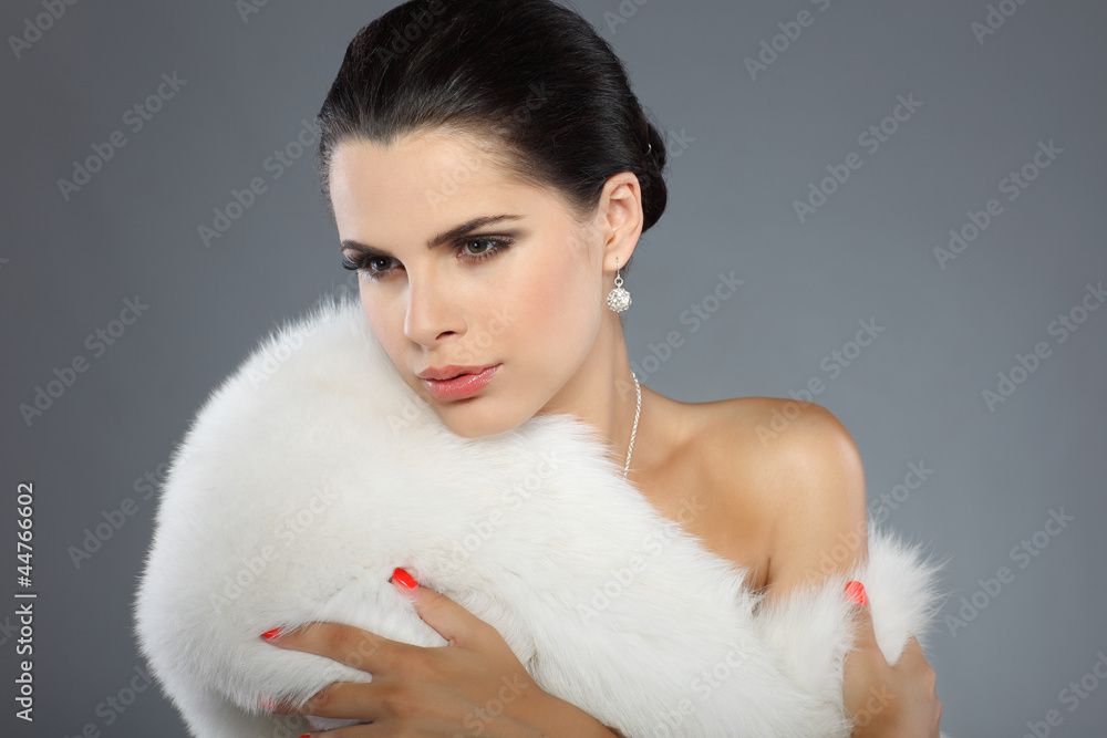 A photo of sexual beautiful girl is in fur clothes A photo of sexual beautiful girl is in fur clothes