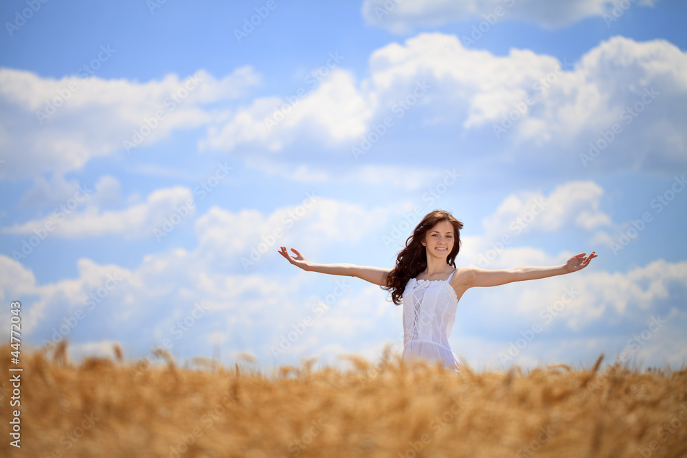 Fototapeta premium Woman enjoying in wheat field