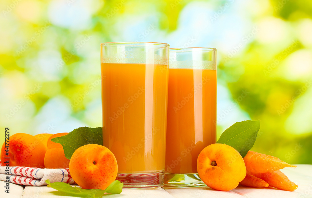 glasses of carrot and apricot juice glasses of carrot and apricot juice