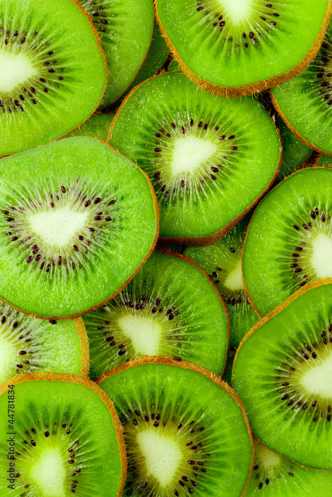 Kiwi fruit slices background - obrazy, fototapety, plakaty 