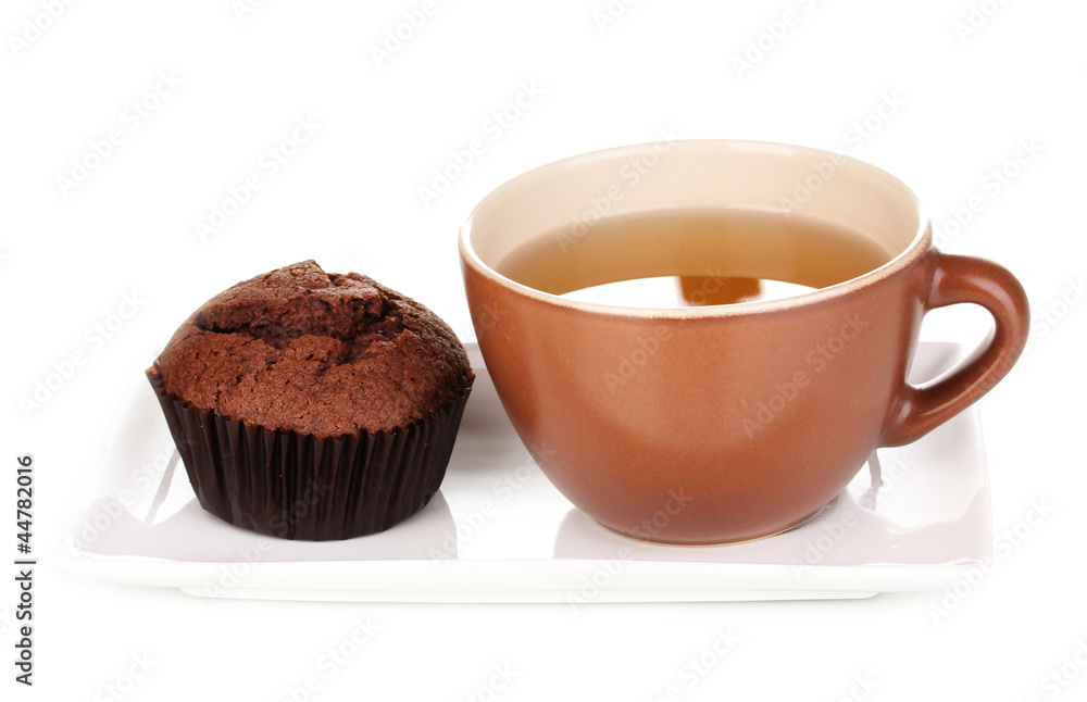 Fresh muffin with tea isolated on white Fresh muffin with tea isolated on white