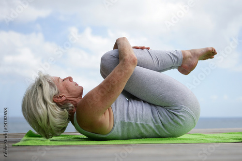 Woman practicing yoga photo