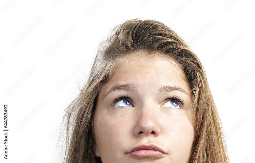 Close-up portrait of a beautiful teenager. Looking up into the c Close-up portrait of a beautiful teenager. Looking up into the c
