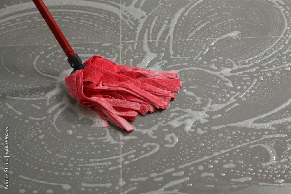 Mopping the floor tiles Stock Photo Adobe Stock