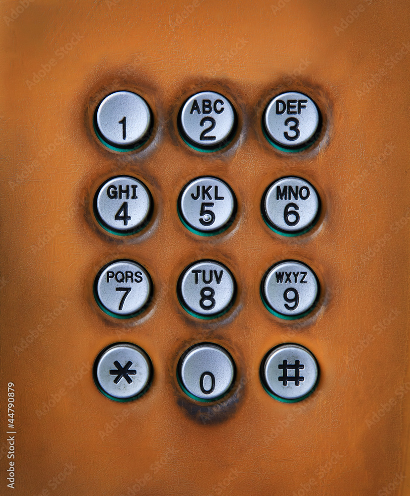 dial number button on old used public telephone dial number button on old used public telephone