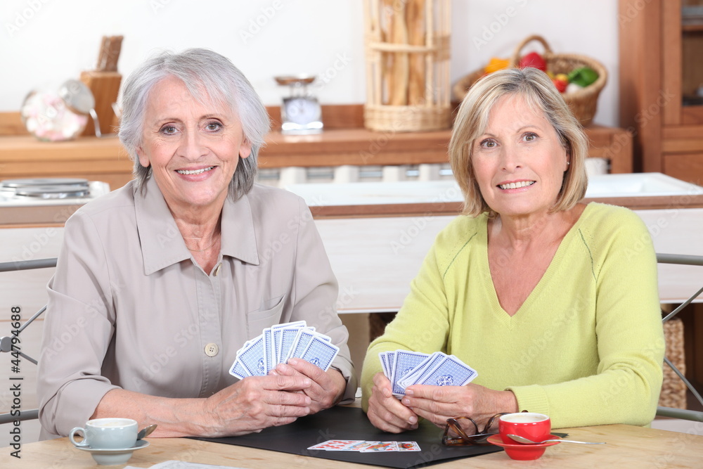 Older women playing cards Older women playing cards