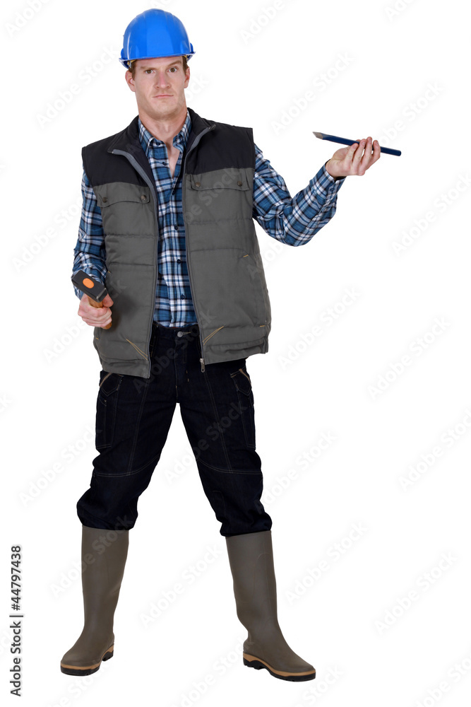 craftsman holding a hammer and a wedge craftsman holding a hammer and a wedge