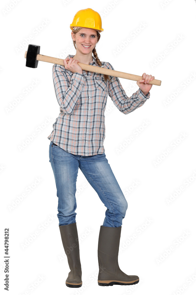 craftswoman holding a huge hammer craftswoman holding a huge hammer
