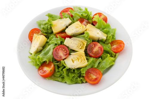 salad with artichoke on the white plate